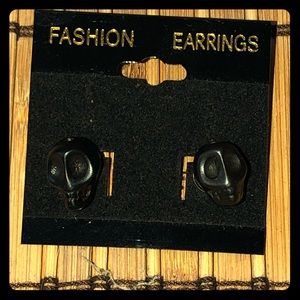 Black skull post earrings.